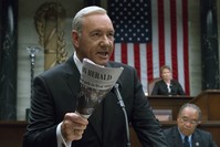 This image released by Netflix shows Kevin Spacey in a scene from ,House Of Cards., Netflix says it is suspending production of ,House of Cards, following harassment allegations against Spacey.