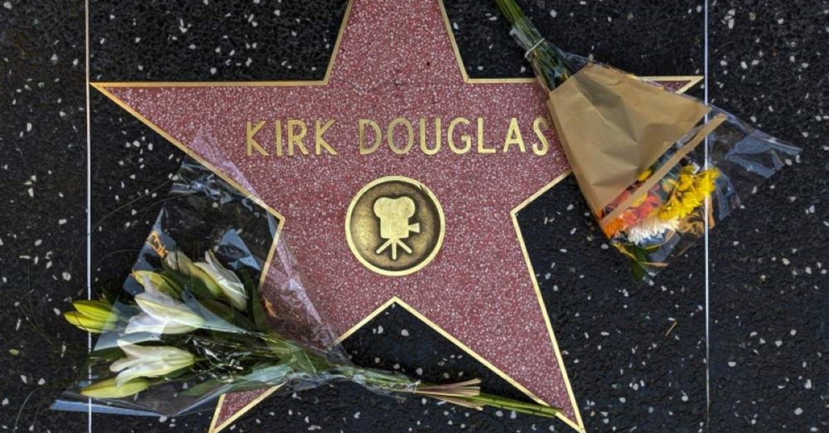 Flowers are placed on actor Kirk Douglas' start on the Hollywood Walk of Fame in Los Angeles, Wednesday, Feb. 5, 2020. (AP Photo)