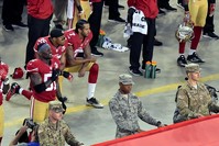 San Francisco 49ers quarterback Colin Kaepernick and teammate Eric Reid kneel during the playing of the national anthem in Santa Clara, California, Sep 12, 2016. (Kirby Lee-USA TODAY Sports)