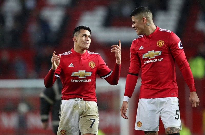 Manchester United's Alexis Sanchez and Marcos Rojo celebrate after the match on Feb. 3, 2018. (Reuters Photo)