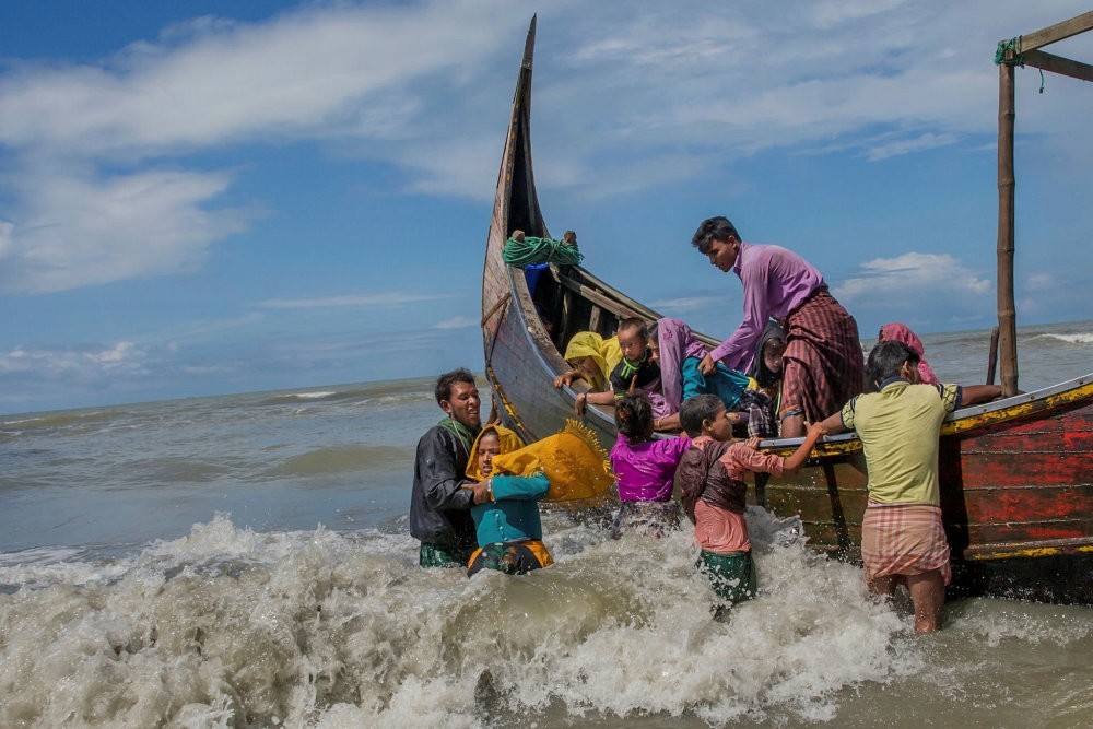 Rohingya refugees arrive on a boat from Myanmar to Bangladesh in Shah Porir Dwip, Sept. 14, 2017.