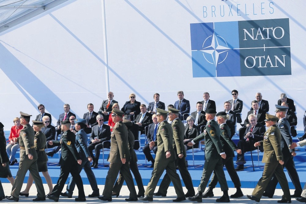 Head of NATO member states watch a march during the inauguration of the new NATO headquarters, Brussels, Belgium, May 25. 