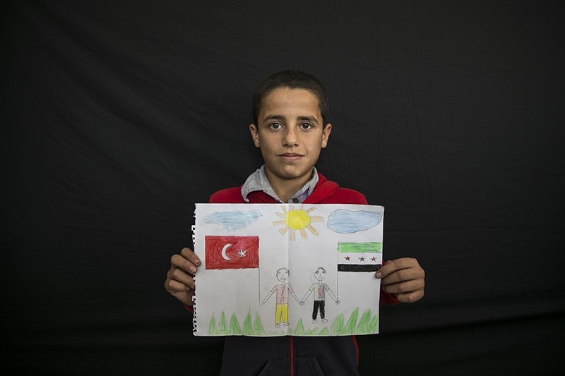 12-year-old Syrian student Sami Abdullah expresses his love for Turkey in a drawing. (AA Photo)