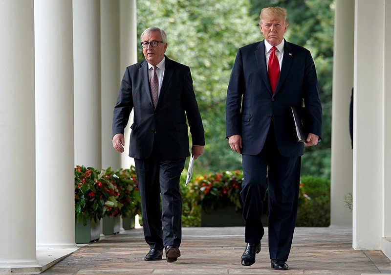 U.S. President Donald Trump and President of the European Commission Jean-Claude Juncker walk together before speaking about trade relations in the Rose Garden of the White House in Washington, U.S., July 25, 2018. (Reuters Photo)