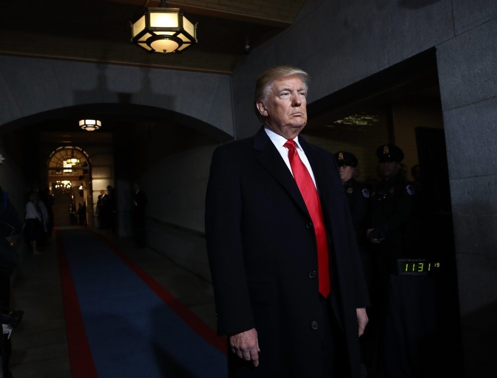 U.S. President Donald Trump at the U.S. Capitol for the inauguration ceremony. Drawing ire with his very long neckties, Trump chose red necktie, referring dominance.