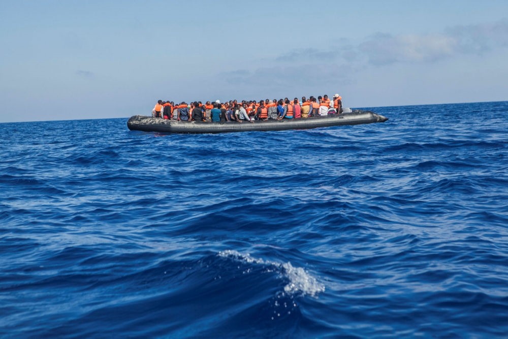 A raft with 129 migrants on board, among them 60 women, sails out of control about 24 kilometers north of al-Khums, Libya, Aug. 1.