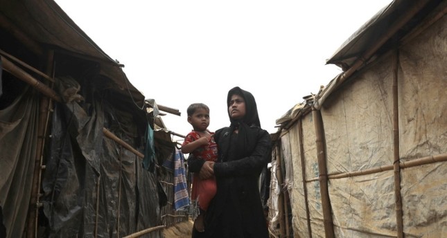 A Rohingya woman with her child at the Kutupalong camp, Cox’s Bazar, Bangladesh, March 25.