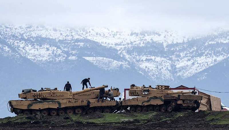 Turkish soldiers train with their tanks and armored vehicles near Syrian-Turkish border, at Hatay, Turkey, 24 January 2018. (EPA Photo)