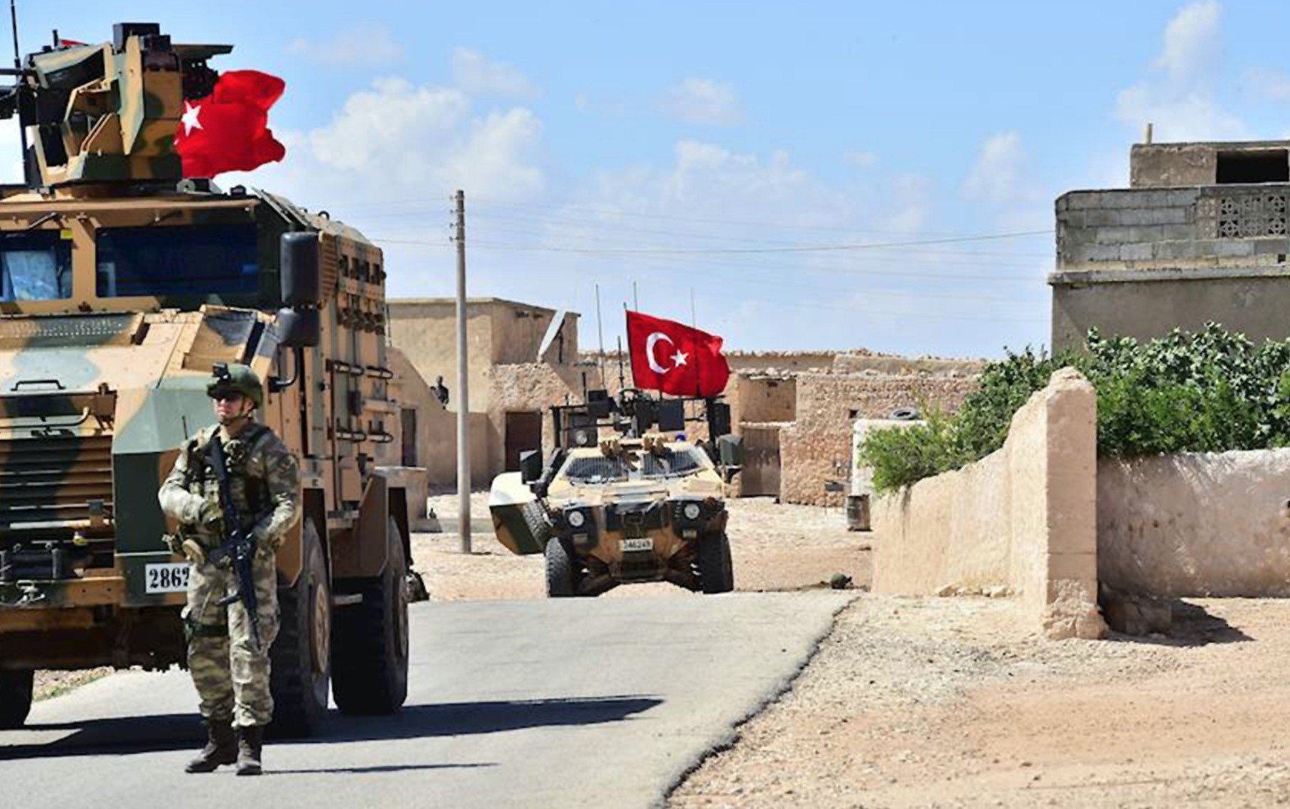 Turkish soldiers accompanied by armored vehicles patrolling near the city of Manbij, northern Syria as the Manbij operation continues with U.S. cooperation, June 18.