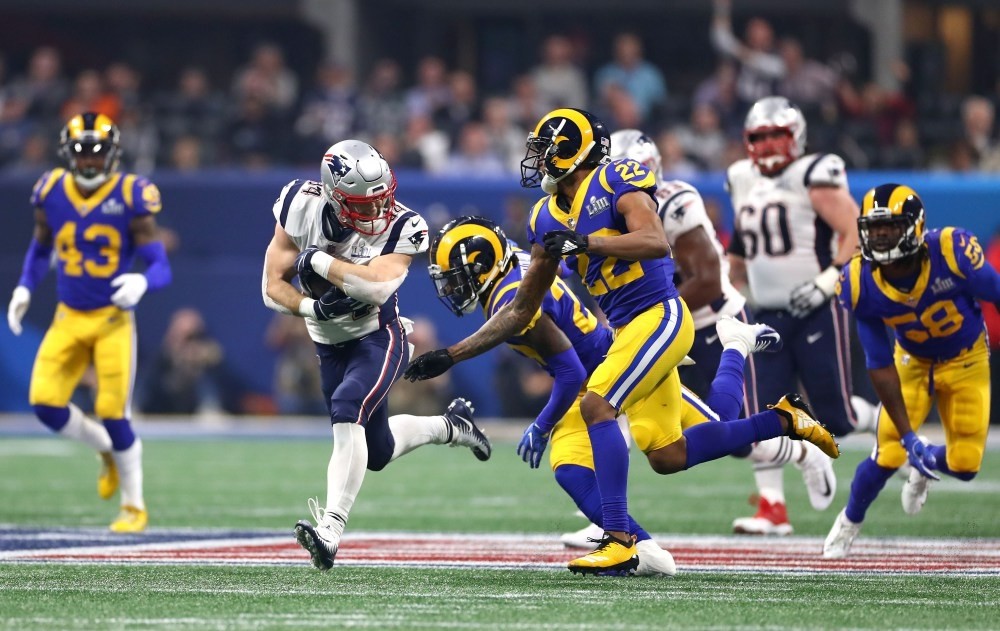 Rex Burkhead of the New England Patriots carries the ball against Marcus Peters of the Los Angeles Rams during the Super Bowl in Atlanta, Feb. 3, 2019.