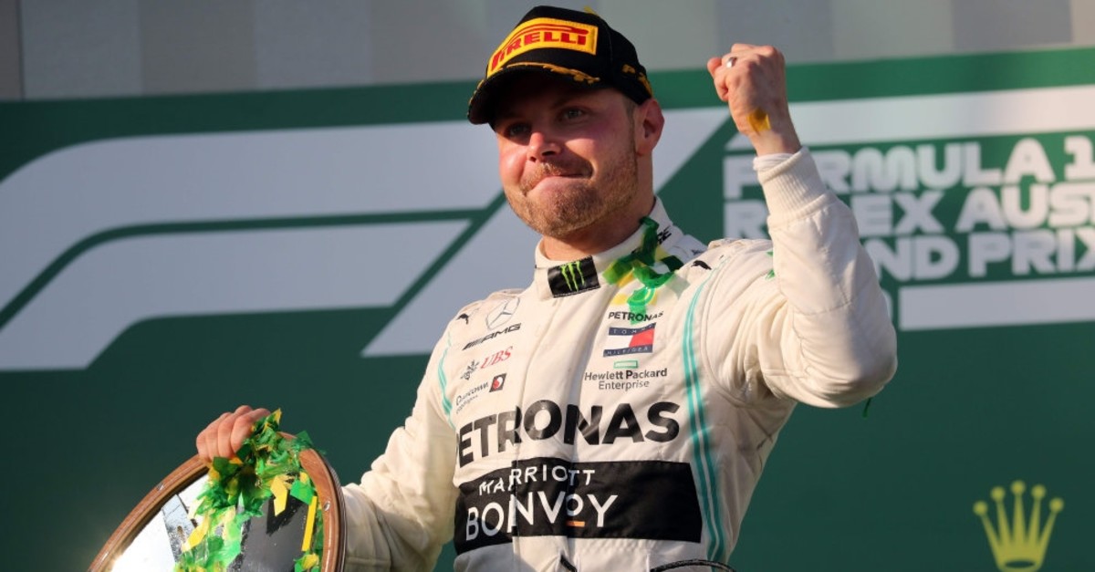 Mercedes' Finnish driver Valtteri Bottas celebrates on the podium after the Formula One Australian Grand Prix in Melbourne on March 17, 2019. 