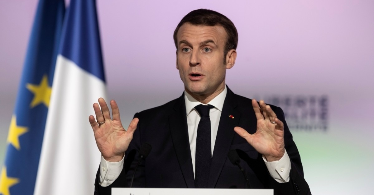 French President Emmanuel Macron gestures as he delivers a speech during a press conference, as a part of his visit to Mulhouse, France, Feb. 18, 2020. (AFP Photo)