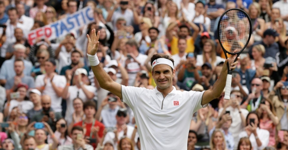u2002u2002u2002u2002 Switzerland's Roger Federer celebrates after beating Lucas Pouile of France in a Men's singles match during day six of the Wimbledon Tennis Championships in London, Saturday, July 6, 2019. (AP Photo)