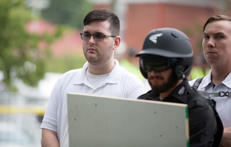 James Alex Fields Jr., (L) is seen attending the ,Unite the Right, rally in Emancipation Park before being arrested by police. (REUTERS Photo)