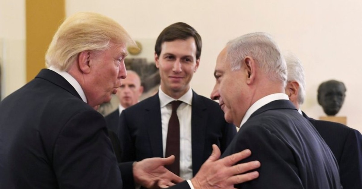 White House senior adviser Jared Kushner (C) listens as U.S. President Donald Trump (L) talks with Israeli Prime Minister Benjamin Netanyahu in Jerusalem, May 22, 2017.
