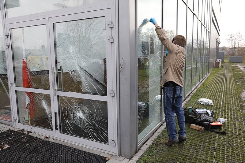 A Polish police technician investigates the damage at the Center of Muslim Culture, Warsaw, Poland, Nov. 27, 2017. (EPA Photo)