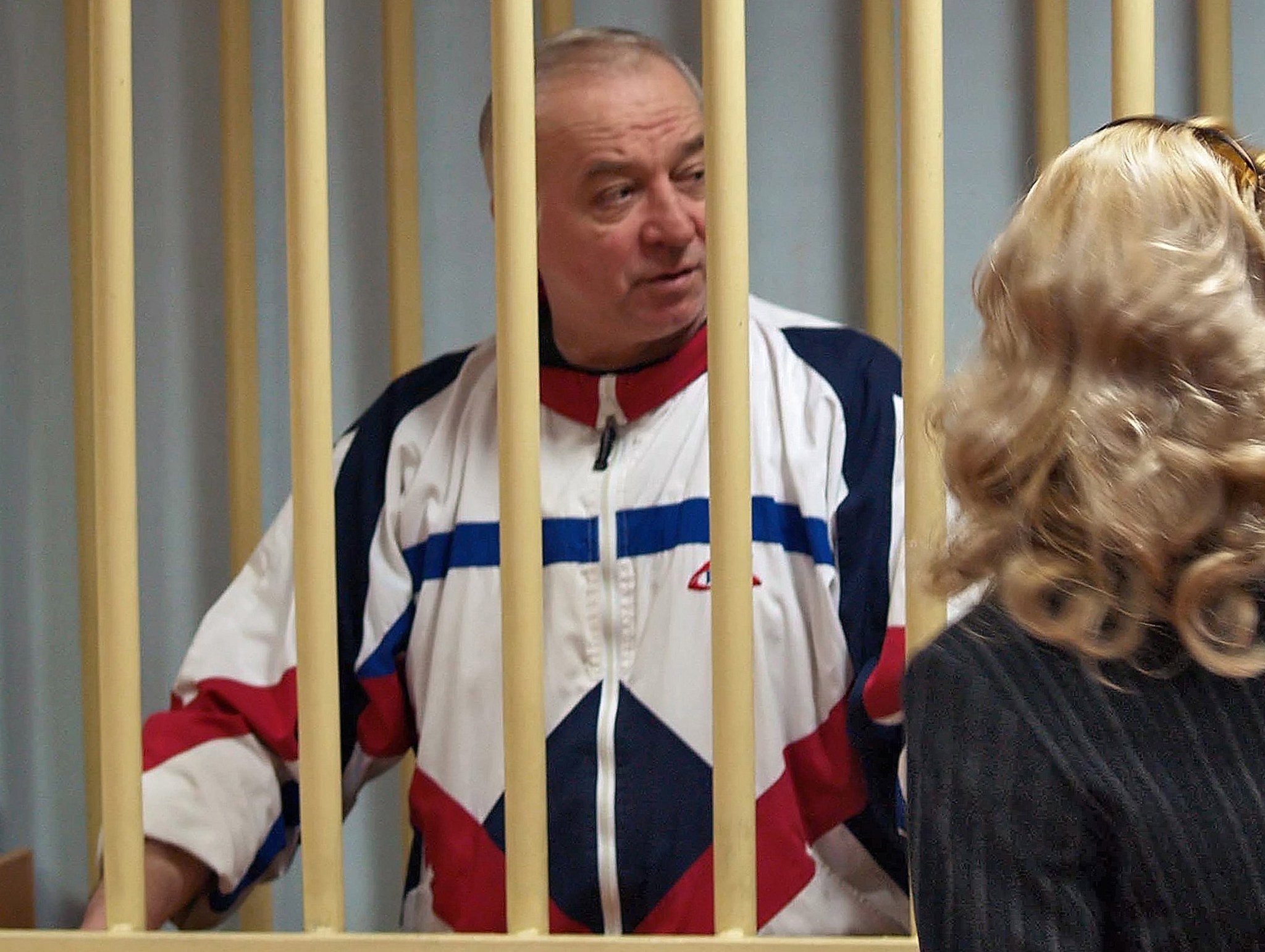 A photo dated August 9, 2006 shows Sergei Skripal talking from a defendants cage to his lawyer during a hearing at the Moscow District Military Court in Moscow. (EPA Photo)