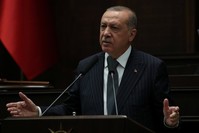 President Recep Tayyip Erdou011fan addresses parliamentarians from the AK Party during a meeting at the Turkish Parliament in Ankara, yesterday.