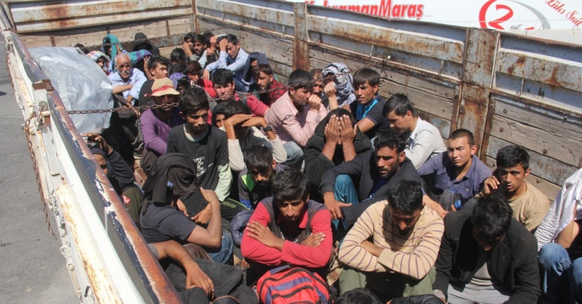 Migrants huddled together in the back of a truck in the southern city of Adana, Sept. 10, 2019. Sixty-one illegal migrants were discovered inside the truck heading to Istanbul.