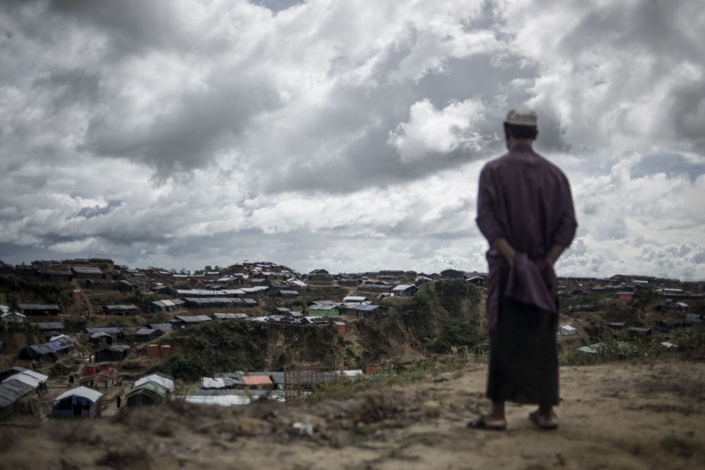 A Rohingya Muslim refugee looks on while standing in front of tents at the Balukhali refugee camp in Bangladesh's Ukhia district, Oct. 6. 