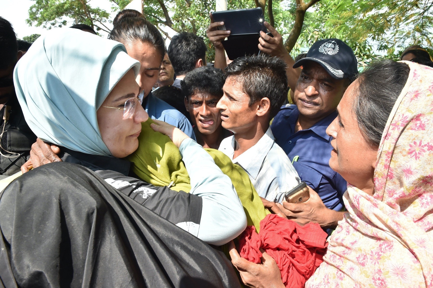 First lady Emine Erdou011fan (L) hugs a Rohingya refugee who fled from the Myanmar government's brutality at a makeshift camp near Coxu2019s Bazar, Bangladesh, September 2017.