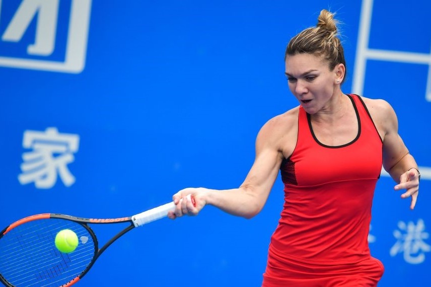 Simona Halep of Romania hits a return against Nicole Gibbs of the US in the first round of the Shenzhen Open tennis tournament in Shenzhen, Jan. 1.