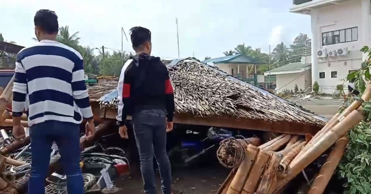 Handout video grab taken Oct. 29, 2019 from the Facebook page of Anthony Allaga shows residents standing next to motorcycles under a temporary shelter after it collapsed during a 6.6-magnitude earthquake in Magsaysay on Mindanao island. (AFP Photo)