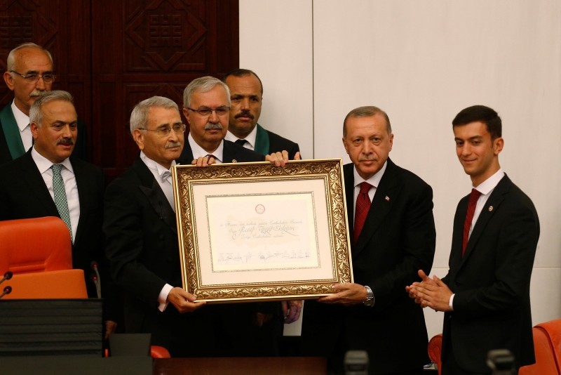 Erdoğan, 2nd right, arrives at the parliament to take the oath of office for his second term as president, in Ankara, July 9, 2018.