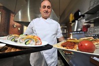 Turgay Kahraman offers sushi and kebab in his restaurant.