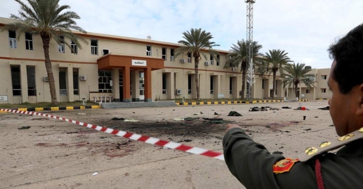 A member of security forces of the Government of National Accord (GNA) gestures as he inspects the site of an attack on a military academy in Tripoli, Libya Jan. 5, 2020. (Reuters Photo)