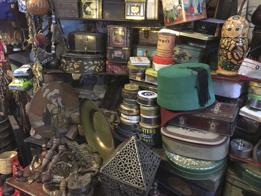 Inside one of the more prominent shops, Osmanlu0131 Antik Palas, items from various eras are piled high.