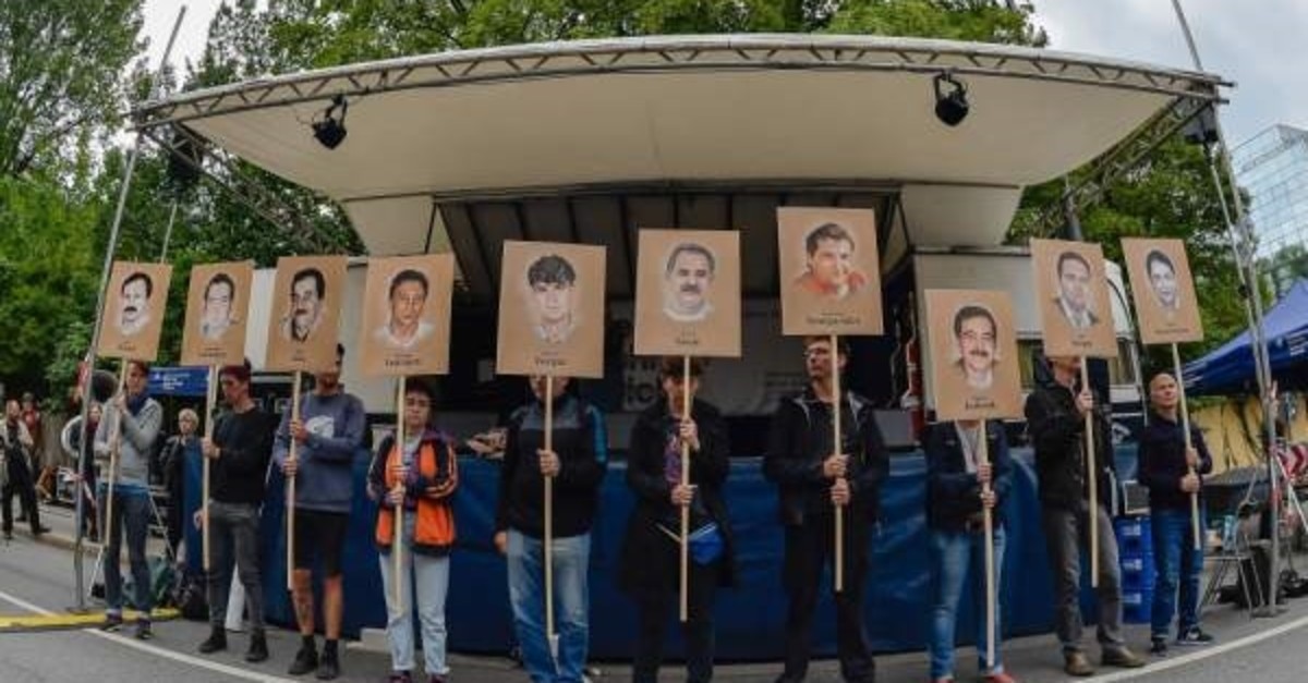 Protesters hold up signs showing pictures of the victims of the neo-Nazi NSU, Munich, July 11, 2018. (AFP Photo)