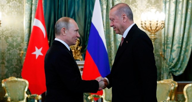 Russian President Vladimir Putin (L) shakes hands with President Recep Tayyip Erdoğan (R) ahead of a meeting at The Kremlin in Moscow on April 8, 2019. (AFP Photo)