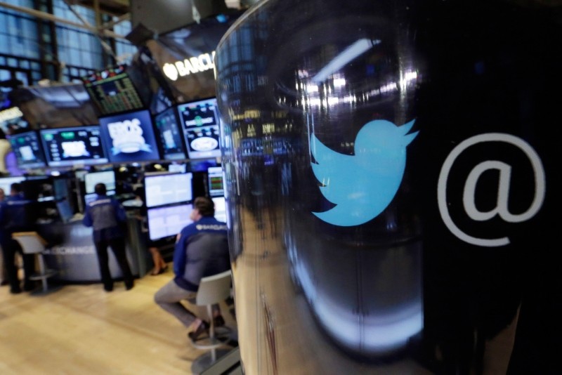 In this Tuesday, Oct. 13, 2015, file photo, the Twitter logo appears on a phone post on the floor of the New York Stock Exchange. (AP Photo)