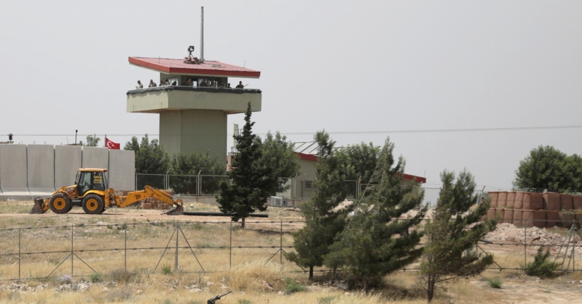 Turkish soldiers stand on a watchtower at the Atmeh crossing on the Syrian-Turkish border, as seen from the Syrian side, in Idlib governorate, Syria, May 31, 2019.