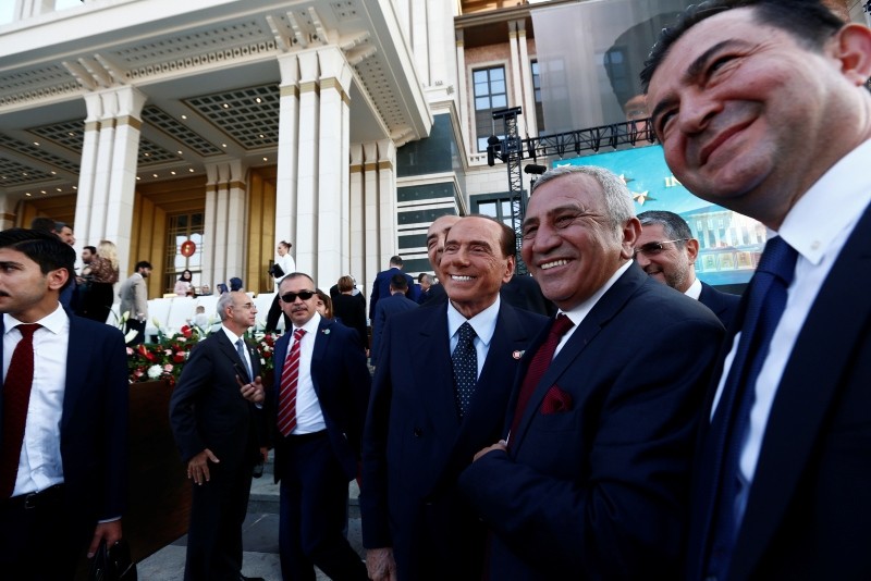 Former Italian Prime Minister Silvio Berlusconi, cente, poses for pictures with other attendees following a ceremony for Erdoğan, Monday, July 9, 2018.r