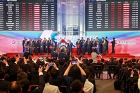 People take pictures during an opening ceremony of the Shanghai Stock Exchange's Sci-Tech Innovation Board, Shanghai, July 22, 2019.