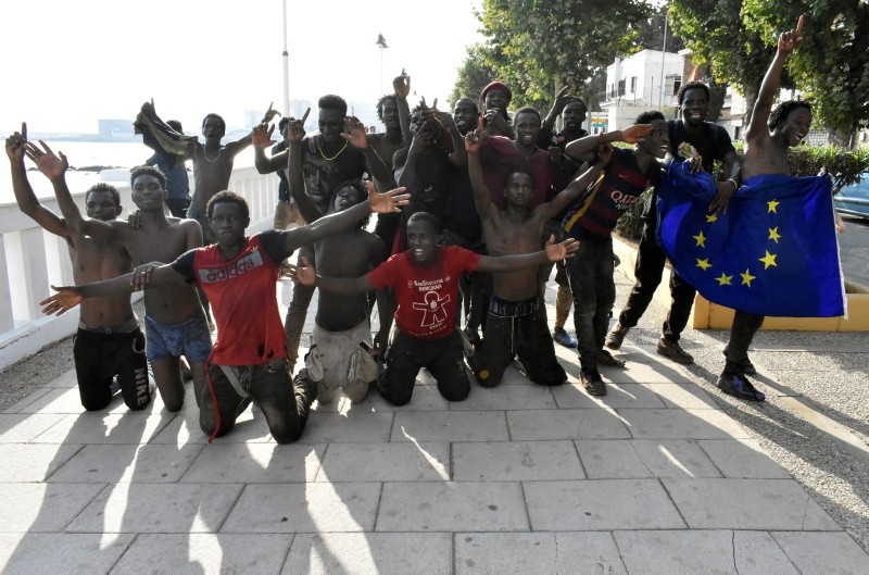 Migrants of the immigrant center CETI welcomes newly arrived African immigrants in the Spanish enclave Ceuta, after some 200 refugees crossed the border fence between Morocco and Ceuta August 22, 2018. (EPA Photo)