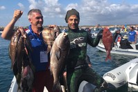 Turkish atlete Ahmet Tekin (R) poses with his catch u2014 a 7-kilo Rubberlip Grunt in Portugal. (AA Photo) 