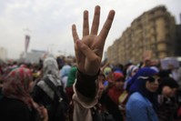 The ,Rabaa,, or ,four,, gesture is in reference to the brutal police clearing of the Rabaa square, which was the pro-Morsi protesters' main area, on Aug.  14, 2013.