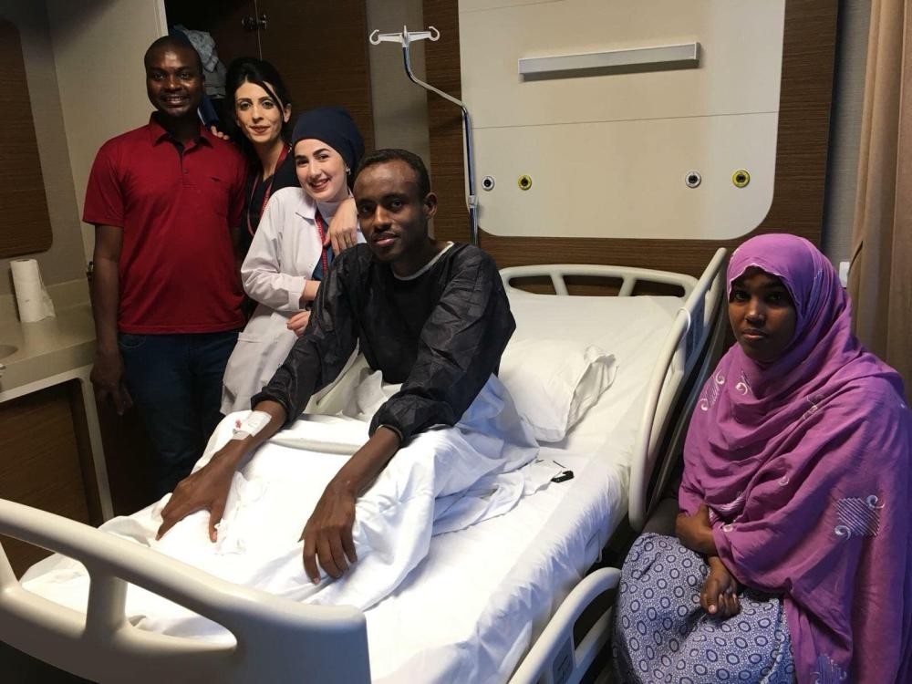 Djiboutian national Elmi Omar Abdullahi poses with his family and healthcare staff in a hospital room in Istanbul on Jan. 17, 2019 after a kidney transplant.