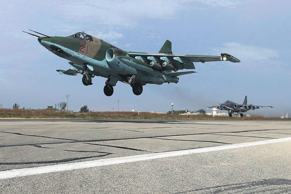 Su-25 fighter jets take off from the Hmeymim Air Base near Latakia, Syria.