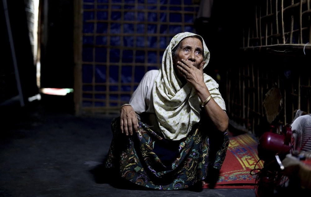 An elderly Rohingya refugee sits inside a family shelter in Kutupalong refugee camp, Bangladesh, Aug. 28.