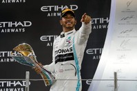 Lewis Hamilton celebrates with a trophy after winning the race, Abu Dhabi, Dec. 1, 2019. (REUTERS Photo)