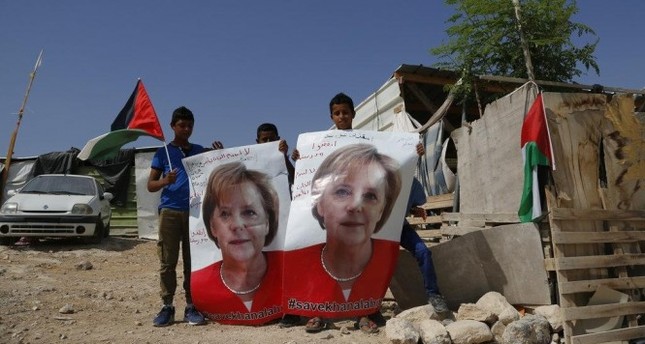 أطفال من الخان الأحمر يطالبون ميركل بالتصدي لقرار هدم قريتهم - رويترز