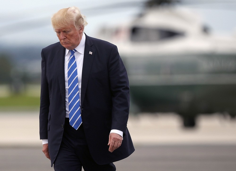 President Trump walks across the tarmac before boarding Air Force One at Hagerstown Regional Airport, Aug. 18, 2017 in Hagerstown, Maryland.