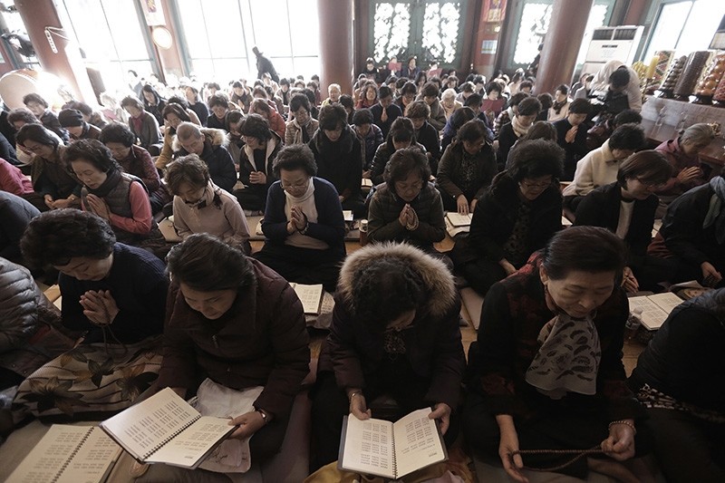 Parents pray for their children's success in the Scholastic Aptitude Test at the Jogye Temple in Seoul, South Korea, Wednesday, Nov. 15, 2017 (AP Photo)