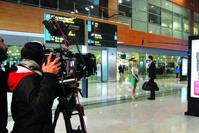 Camera crew films at Sabiha Gu00f6ku00e7en Airport in Istanbul, Turkey.