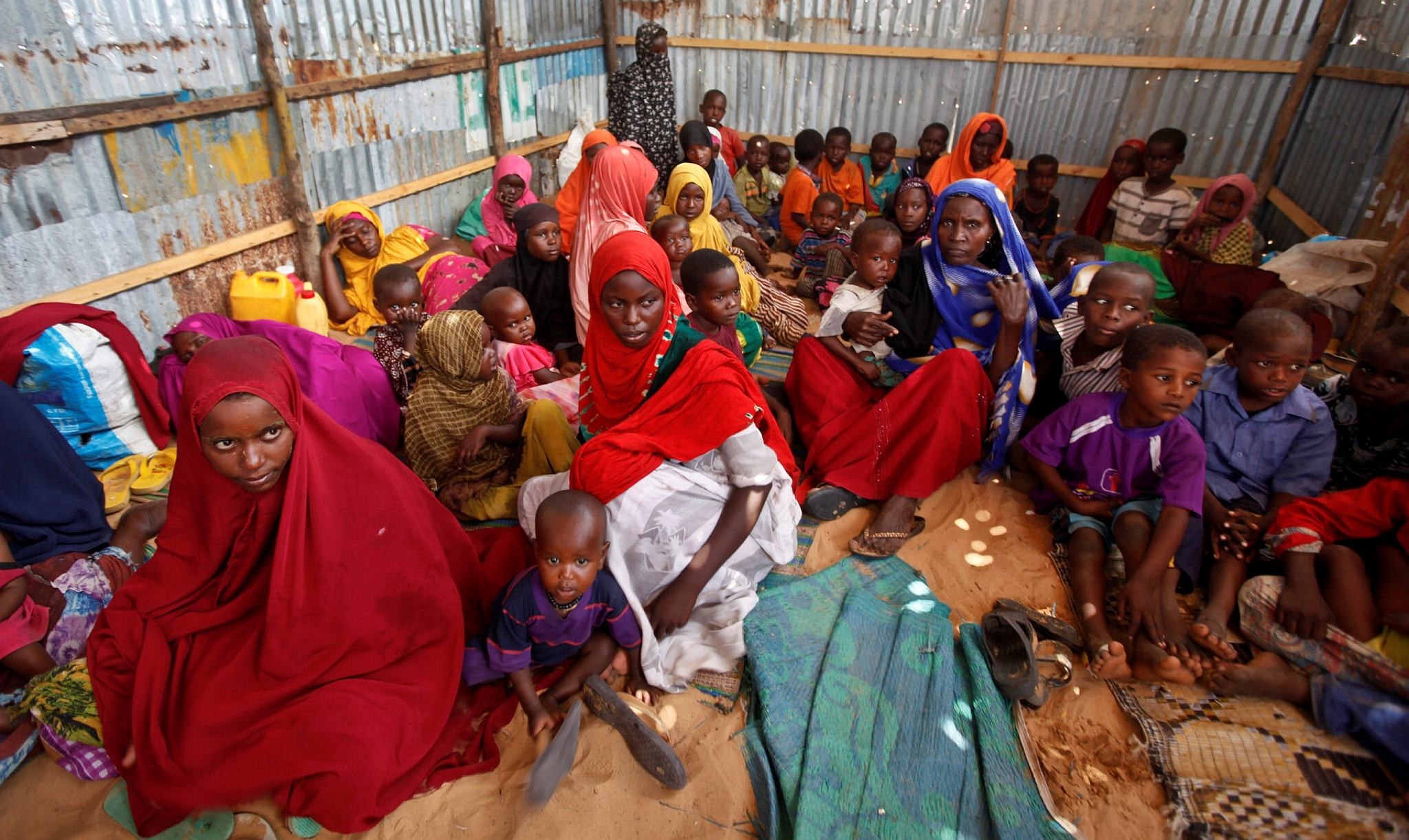 Displaced Somalis who fled the drought in southern Somalia sit in a camp in the capital Mogadishu, Somalia. (AP Photo)