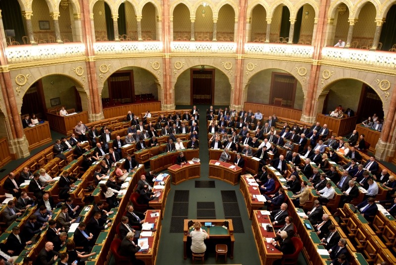 Members of the Hungarian government vote on the 'Stop Soros' package of bills that criminalises some help given to illegal immigrants, at the Parliament in Budapest, Hungary, June 20, 2018. (Reuters Photo)